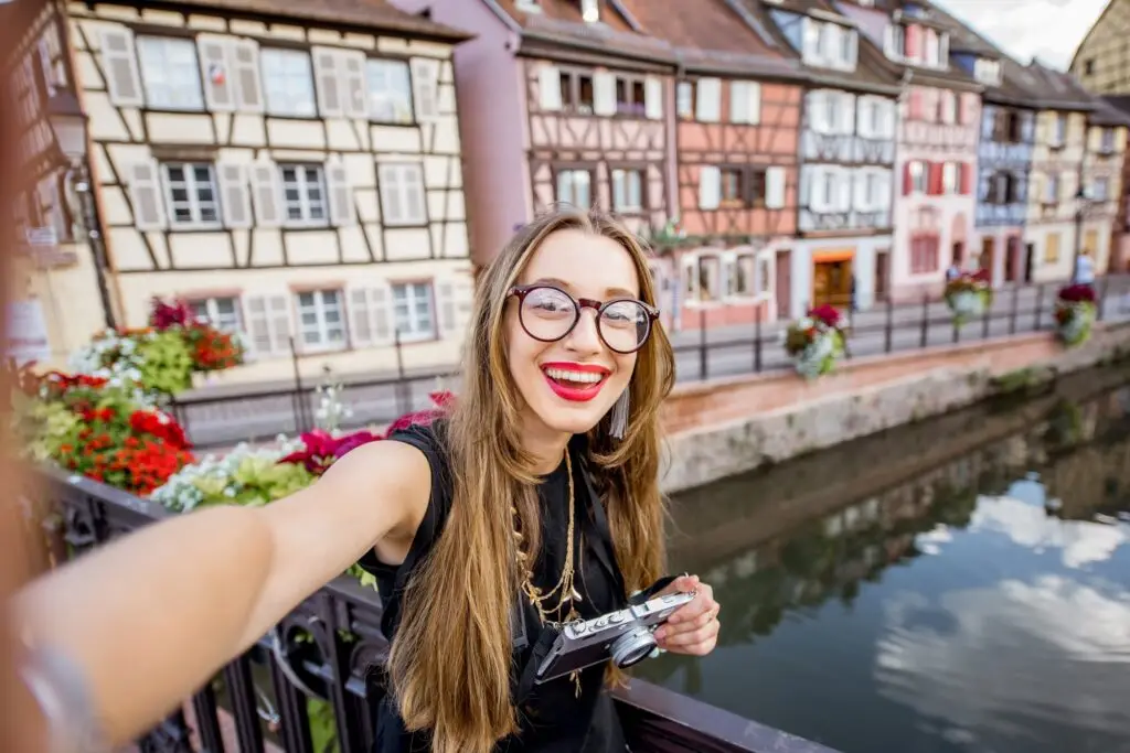 Woman traveling in Colmar village, France