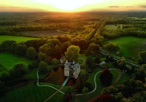Aerial shot of a sunset over the Dutch castle in Ruurlo, Gelderland, the Netherlands.