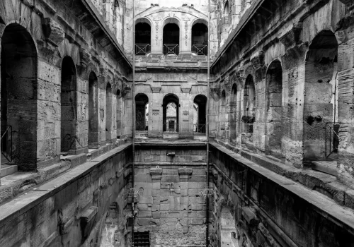 Grayscale image of the ancient Porta Nigra Roman city gate walls from the inside, in Trier, Germany